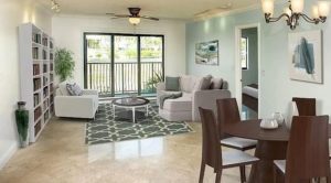 bright living room with large window, balcony, tile flooring