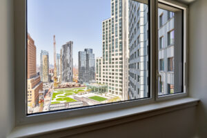 Window view of city, and sprawling skyline.